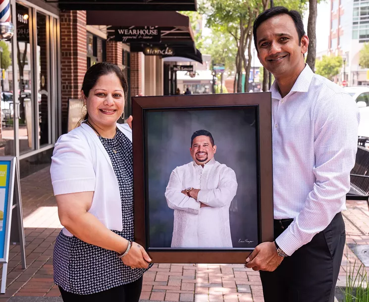 Shubhangi Musale holds a photo of her late brother Mahesh along with her husband Neelesh Musale. - PHOTO BY MICHAEL ANTHONY