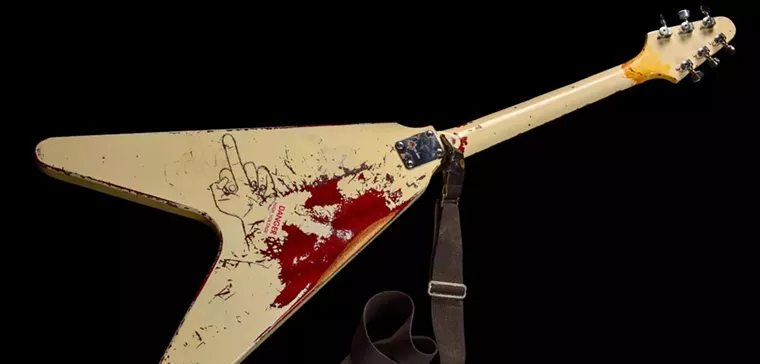 Metallica's James Hetfield makes a one-finger statement on the back of his Flying V. - PHOTO BY LISA S. JOHNSON