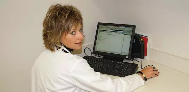 Chris Marker, RN, BSN of the Prairie Cardiovascular Consultants demonstrates the electronic medical records (EMR) system. - PHOTO BY DAVID HINE