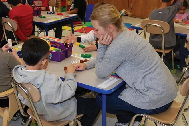 Classroom workers, known as paraprofessionals, work difficult jobs at low wages. Many could become teachers if barriers to certification were addressed.