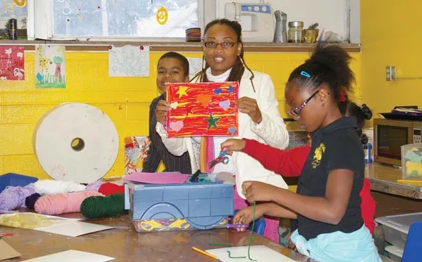 Letrice Ware leads students at the Boys and Girls Club through an after-school art project. - PHOTO BY RACHEL WELLS