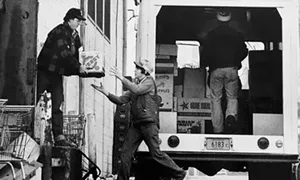 Barry Locher, then a State Journal-Register photographer, snapped this shot of volunteers loading up donations at a local market in 1979. - PHOTOS COURTESY OF THE SANGAMON VALLEY COLLECTION.