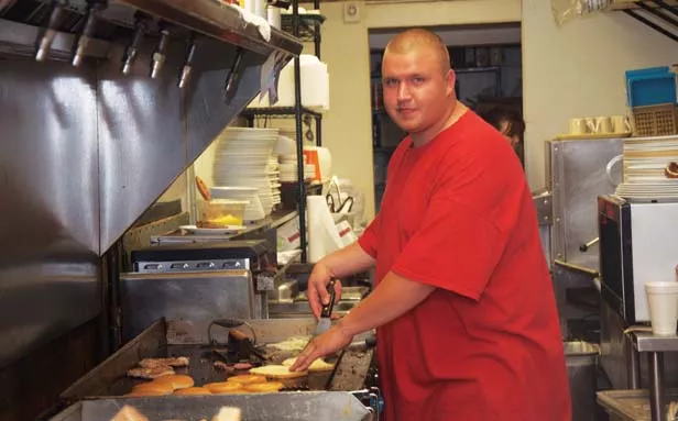 Justin Smith has been a cook at Debbie’s Diner for the past two years under the state’s work-release program. - PHOTO BY GINNY LEE