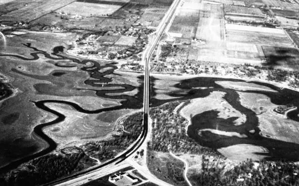 An aerial photo taken by 1954 CWLP employee Chuck Laswell shows Old Sugar and Lick creeks cross the dry bed of drought-ravaged Lake Springfield. - PHOTO COURTESY THE SANGAMON VALLEY COLLECTION AT LINCOLN LIBRARY.