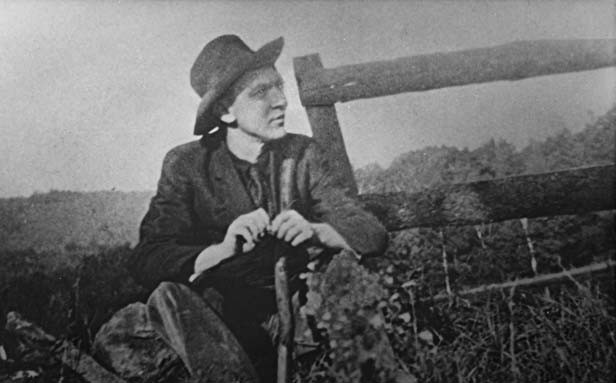 Vachel Lindsay, like his hero Johnny Appleseed, walked across most of the United States, sometimes trading his poems for food and lodging. Here he pauses for dinner with a grasshopper, probably in a Rocky Mountain meadow, circa 1921. - PHOTO COURTESY ABRAHAM LINCOLN PRESIDENTIAL LIGBRARY