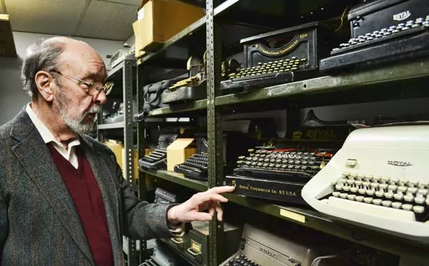 Ben Bushnell, 82-year-old owner of Royal Office Equipment in Springfield, looks over his inventory of antique typewriters. - PHOTO BY JACQUELINE MUHAMMAD