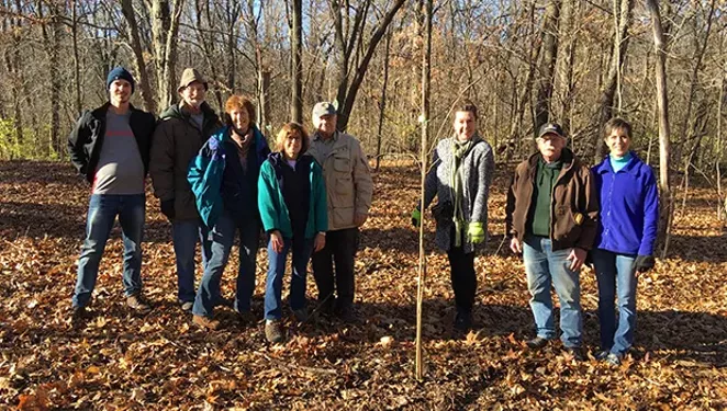 Members of the Springfield South, Sunrise and Midtown Rotary Clubs planted trees at Lincoln Memorial Garden in December. Larry Miller, Lincoln Memorial Garden head gardener, is second from right.
