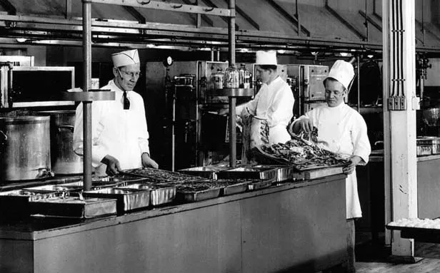 An undated photo of the Leland Hotel’s kitchen, with Chief Chef Joe Schweska at right wearing a traditional chef’s tocque. 
