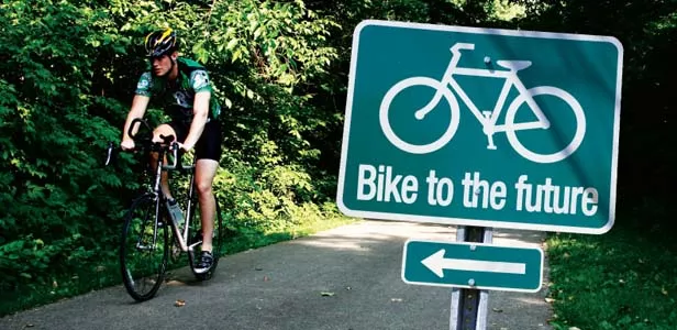 A cyclist enjoys the Lost Bridge Trail connecting Springfield and Rochester. - PHOTO BY PATRICK YEAGLE