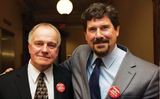 Steidl managed a rare smile after the Senate voted for death penalty repeal. He watched the vote with Bill Clutter of the Downstate Illinois Innocence Project. - PHOTO BY GINNY LEE
