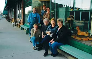 Village residents found downtown on a recent afternoon include business owners Peter Neihaus, Bill and Kathy Cosby (standing); artist Renee Sisk, business owner Andrea Neihaus, historian Gillette Ransom, and Linda Gleason (seated).