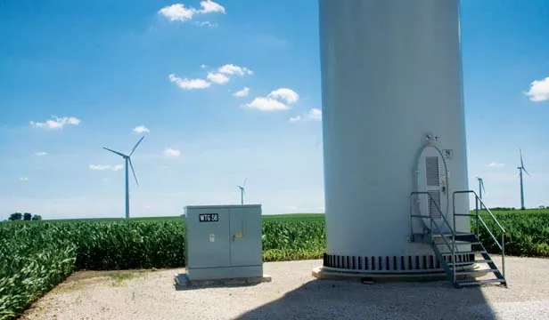 The base of a wind turbine near Hopedale, Ill., sits next to an electrical transformer on a small plot leased from rural landowners. About 200 such turbines could be erected in Sangamon County as early as 2012. - PHOTO BY PATRICK YEAGLE