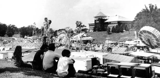 In the 1960s a family rests on the knoll overlooking Happy Hollow, former home of the fair’s carnival midway. - PHOTOS COURTESY OF SANGAMON VALLEY COLLECTION