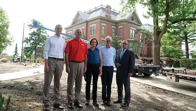Team players, left to right: Neil Brumleve of Massie Massie and Associates, Chris Stritzel of CMT Engineers, Laura Hochuli of Vinci Hamp Architects, Kent Massie of Massie Massie and Associates and Springfield public works director Mark Mahoney in front of - PHOTO BY LEE MILNER