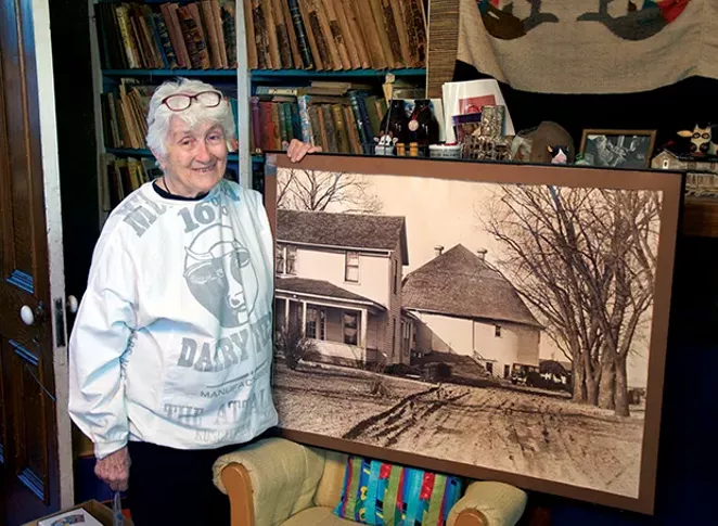 Jackie Jackson, at home on Fifth Street in Springfield, with her former home in Wisconsin, the subject of her recently completed magnum opus. - PHOTO BY GINNY LEE