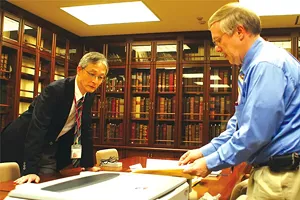 Papers project director Daniel Stowell, right, studies documents during a 2012 trip to Mesei University in Japan, which holds the largest known collection of Lincoln documents outside the United States. - PHOTO COURTESY OF THE PAPERS OF ABRAHAM LINCOLN