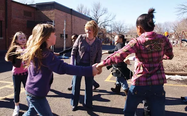 Counterclockwise from left, Hannah Myers, Skye Palmer, Bria Price, Sakoyia Wrenn and Bryannah Kittrell surround McClernand Elementary School Principal Jennifer Gill. - PHOTO BY DAVID HINE