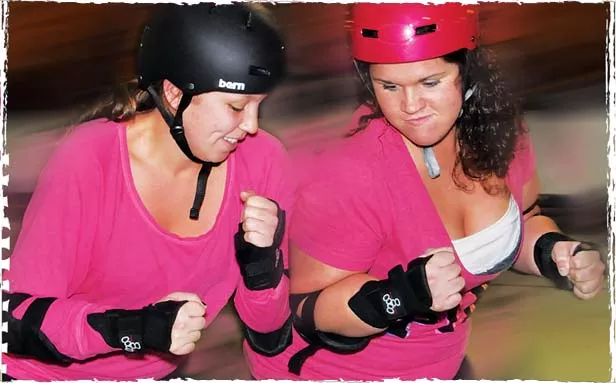 Mia Madness, aka Maria Hillen, and NAG EM, aka Megan R. Martin, practicing the shoulder block. - PHOTO BY TREVOR MILLER