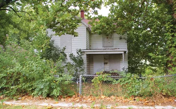 A vacant and boarded house on Springfield’s east side, where consultants nine years ago recommended concentrated code enforcement. - PHOTO BY DAVID HINE
