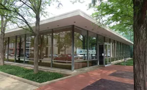 The Cummins Inc. Irwin Conference Center, designed in 1954 by Eero Saarinen, in downtown Columbus is a low, glass-walled building that’s set in a grove of trees. Formerly the Irwin Union Bank and Trust, the building teamed up the architect with la - PHOTO BY JOHN CAMPER.