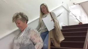 Accompanied by her mother Debbie Webster, left, Jennifer Watkins leaves the courtroom after giving up a custody fight for her daughter Sidney.