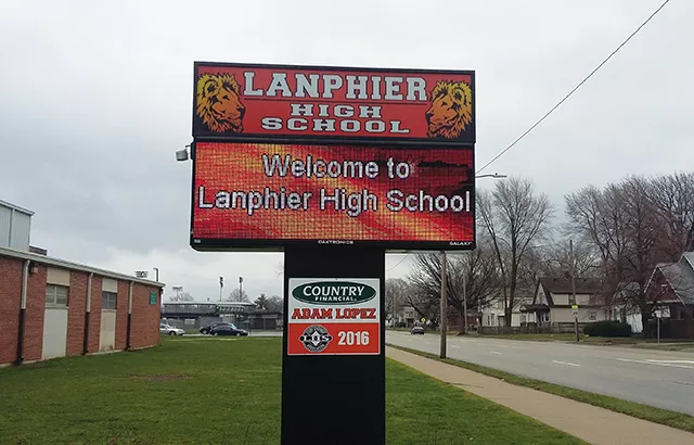 Springfield school board president Adam Lopez says that he can’t explain why his name is on signs posted inside and outside Lanphier High School. - PHOTO BY BRUCE RUSHTON