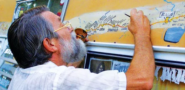 Bob Waldmire working on the map on his van at the Route 66 Rendezvous, September 2008. - PHOTO BY DARLEEN BITTER