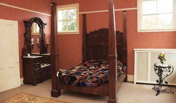 The bedroom of Alice Edwards, the middle daughter of the Edwards family. She was married in 1865, and she and her husband lived there for nineteen years. It is the most recently restored room at Edwards Place. - PHOTO BY GINNY LEE