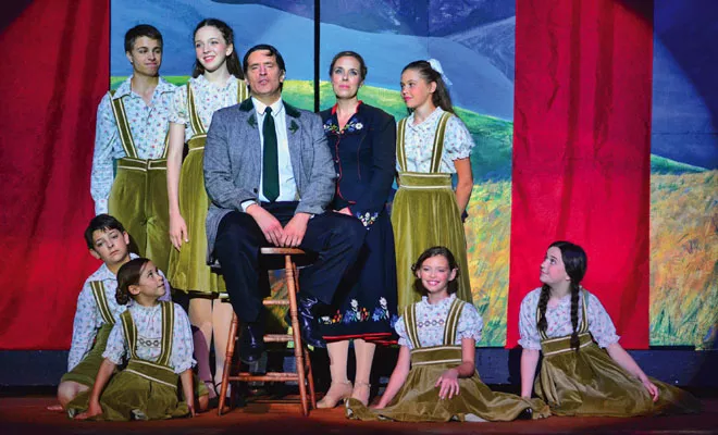 Captain Von Trapp (John O’Connor, center) surrounded by Maria and his seven children. - PHOTO BY DONNA LOUNSBERRY