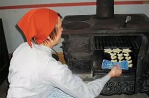 Christa Downing bakes cookies in preparation for the Bishop Hill Julmarknad (Christmas market), held annually in the Swedish settlement in Henry County. This year’s market will be Nov. 27-29 and Dec. 5-6. - PHOTO COURTESY OF BISHOP HILL STATE HISTORIC SITE