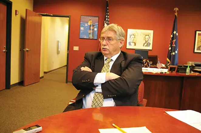 Challenger Frank Edwards, pictured while he was mayor following the death of Tim Davlin, attacks Langfelder for his handling of CWLP and crime.