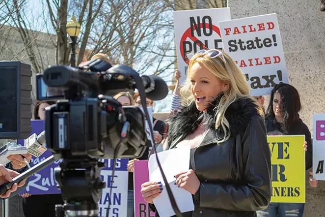 Adult film entertainer Stormy Daniels is pictured at an appearance at the Illinois State Capitol March 22. Daniels spoke for about two minutes, reading from prepared remarks against a six-year-old adult entertainment facilities tax, the proceeds of which - PHOTO BY JERRY NOWICKI, CAPITOL NEWS ILLINOIS