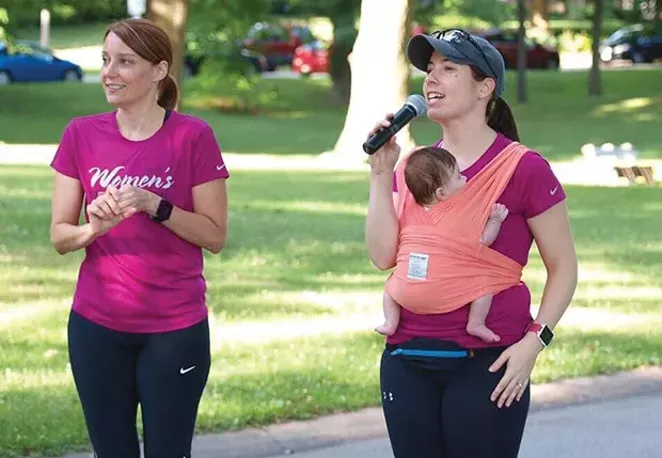 Teri Taylor, left, and Heather Glessner (with her 3 1/2-month-old baby girl who is now 3) directing the Women's Distance Festival. Taylor and Glessner have directed the Women's Distance Festival for the last five years. - PHOTO COURTESY OF HEATHER GLESSNER