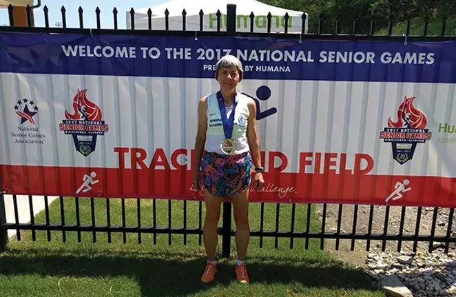 Becky Baum with one of three gold medals earned at the 2017 National Senior Games in Birmingham, Alabama. - PHOTOS BY BECKY BAUM