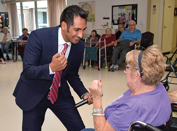 Barrenzuela engages in salsa dancing with Joann Morris, who was undergoing rehabilitation at Sunny Acres Therapy & Senior Services in Petersburg.