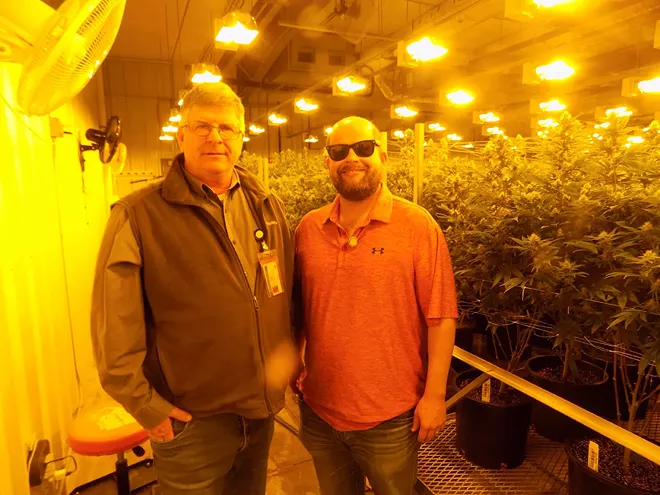 The future of the pot business is so bright that TIm O'Hern, right, wears shades while his father Larry O'Hern compares growing weed to traditional agriculture. - PHOTO BY BRUCE RUSHTON.