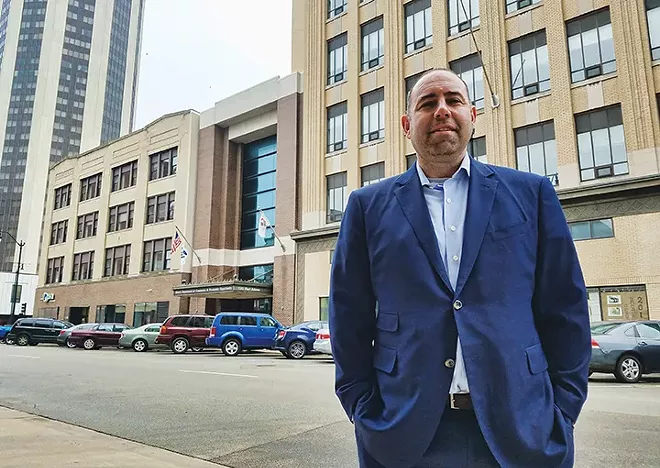 Chris Stone, who owns a seven-story building that was once a department store, says the city needs to make things easier for downtown developers. - PHOTO BY DAVID HINE