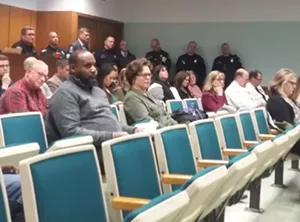 Springfield police officers watch as aldermen talk about carbon monoxide at Tuesday's city council meeting. - PHOTO BY BRUCE RUSHTON