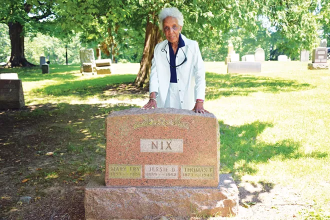Theresa Faith Cummings by the grave of ancestors Mary Fry, Jessie Nix and Thomas Nix in the Colored Section of Oak Ridge Cemetery. - PHOTO BY DAVID BLANCHETTE