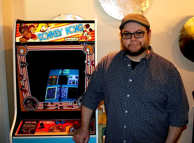 Arlington’s owner, Ebben Moore, said he is an arcade geek and incorporating the games into his business was a natural fit. - PHOTO BY BRANDON TURLEY
