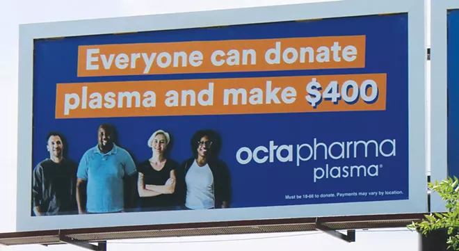 A billboard at 11th Street and South Grand Avenue touts how much money an individual can make by donating plasma. - PHOTO BY STACIE LEWIS