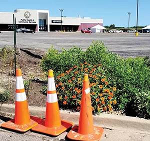 On the morning of Friday, Aug. 7, about 30 cars waited in line for testing outside the Sangamon County Department of Public Health building. - PHOTO BY RACHEL OTWELL