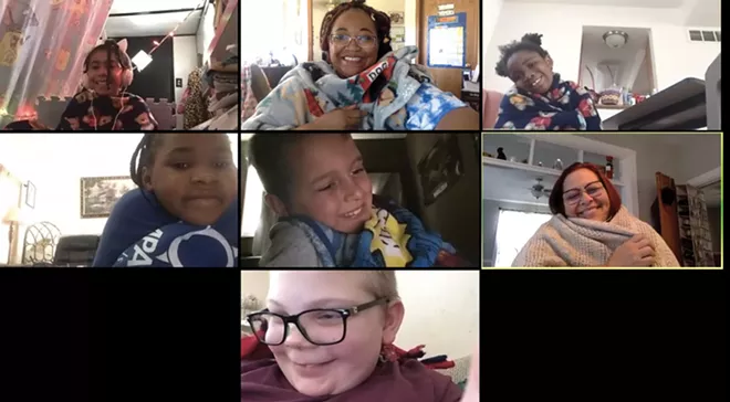 Camp Compass went remote this summer. Students show off blankets they made as an enrichment activity during a lesson. - CREDIT: COURTESY OF CAMP COMPASS