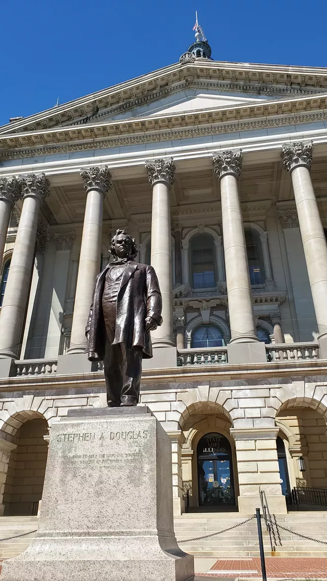 The statue of Stephen A. Douglas that is slated for removal is in a prominent position outside the visitor's entrance of the Illinois Capitol. - RACHEL OTWELL