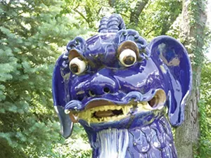 One of 22 blue porcelain fu dogs greets visitors to one of 14 formal gardens at Allerton Park, a few miles outside Monticello. Robert Allerton traveled the world collecting sculptures to add to his estate. - PHOTO BY BRENT BOHLEN