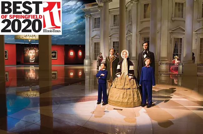 The president and his family greet visitors in the ALPLM’s entry plaza, with a replica of the White House in the background. - PHOTO E. JASON WAMBSGANS