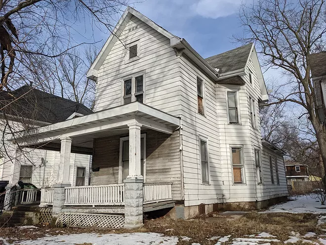 A lawyer and unsuccessful candidate for public office who's owned this boarded-up Enos Park house since 2012 says that he expects an occupancy permit next month. - PHOTO BY BRUCE RUSHTON