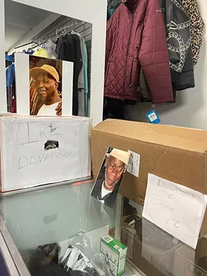 Two donation boxes for the funerals of victims of fentanyl-overdose deaths sit at Brown’s store. - CREDIT: MARNELL BROWN