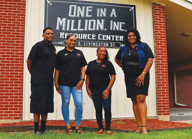 Michael Williams, Shymeka Kerr-Gregory, Erica Austin and Cherena Douglass stand outside of the center where community organizers meet. - CREDIT: ZACH ADAMS, 1221 PHOTOGRAPHY