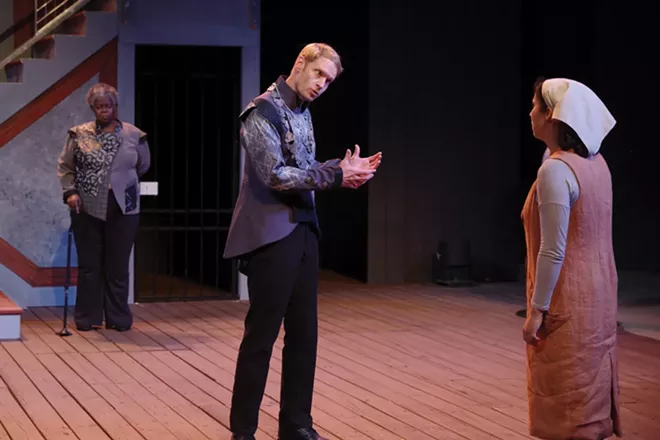 In the final scene of Measure for Measure, Isabella, a young novice to the Order of St. Clare (played - by Isa Guitian, right), challenges the all-powerful Duke of Vienna (Grant Goodman, center) as she seeks - justice for her wrongly imprisoned brother. The noble person Escalus (Lisa Gaye Dixon, left), the Duke’s second in command, buttresses Isabella’s suit. - PHOTOGRAPHY BY PETE GUITHER